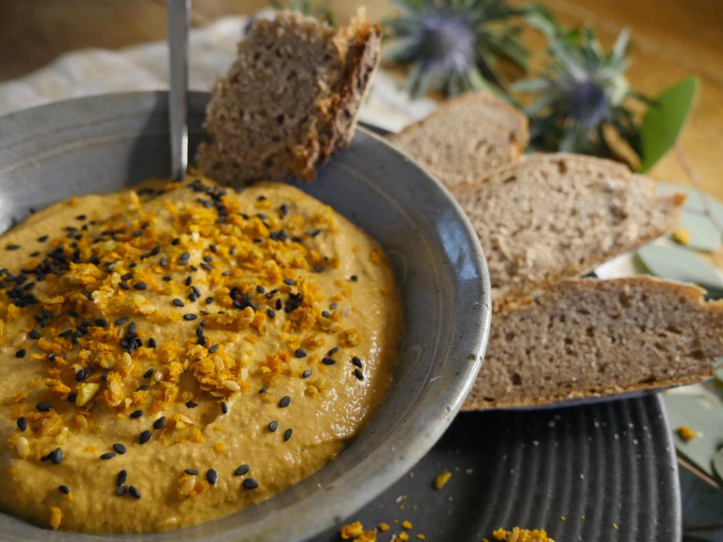 Golden dip with seeds and sourdough bread