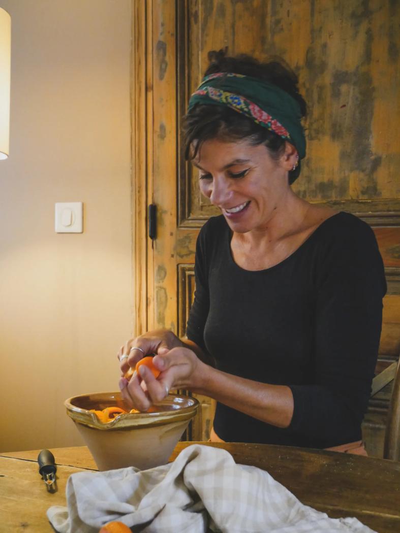 Portrait of Amandine smiling as she cooks