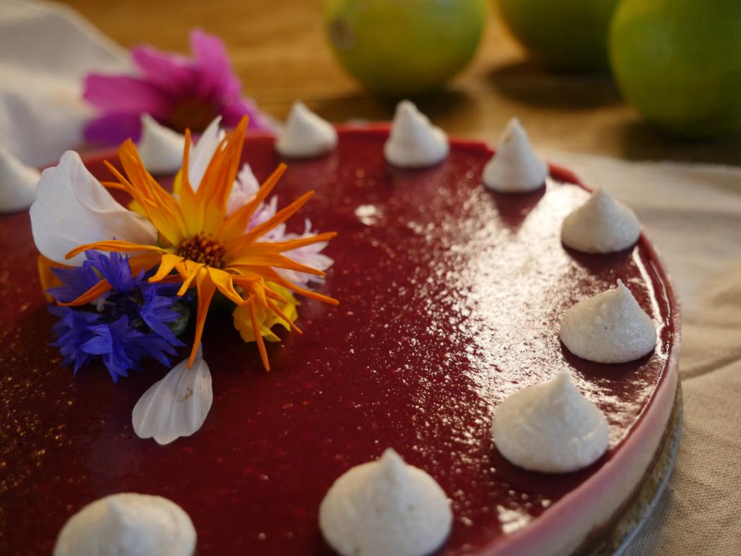 Raspberry cheesecake decorated with edible flowers